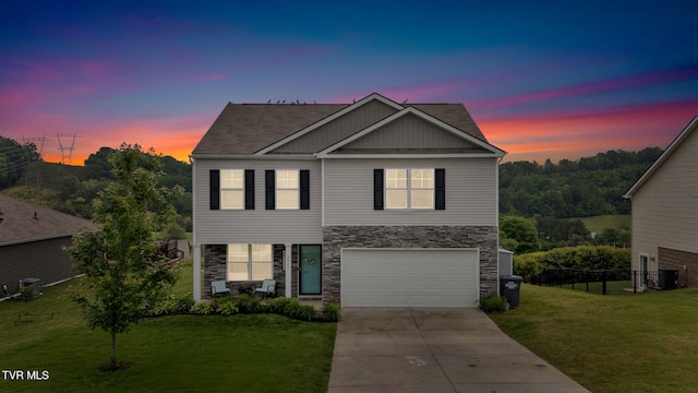 view of front of property featuring stone siding, driveway, central air condition unit, an attached garage, and board and batten siding