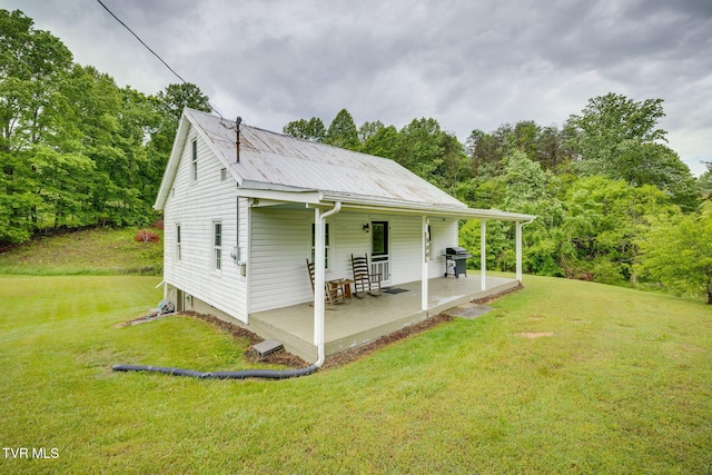 894 Mountain View Rd, Rogersville, TN 37857 - view of side of home featuring a lawn and metal roof