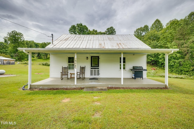894 Mountain View Rd, Rogersville, TN 37857 - view of front facade with covered porch, a front yard, and metal roof