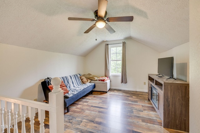 894 Mountain View Rd, Rogersville, TN 37857 - living area with a textured ceiling, hardwood / wood-style floors, vaulted ceiling, ceiling fan, and baseboards