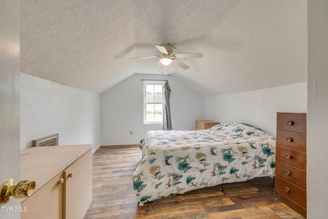 894 Mountain View Rd, Rogersville, TN 37857 - bedroom with wood finished floors, lofted ceiling, a textured ceiling, and a ceiling fan
