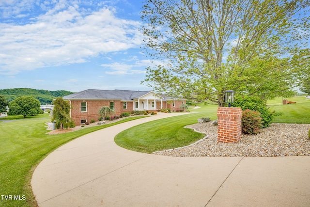 20484 Lake Rd, Abingdon, VA 24211 - view of front facade with brick siding, a front yard, and curved driveway
