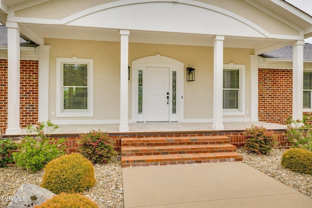 20484 Lake Rd, Abingdon, VA 24211 - doorway to property featuring a porch, brick siding, and stucco siding