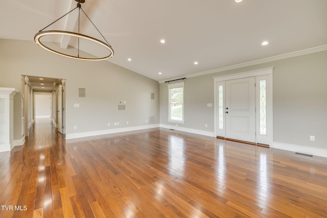 20484 Lake Rd, Abingdon, VA 24211 - unfurnished living room with wood-type flooring, baseboards, crown molding, lofted ceiling, and recessed lighting