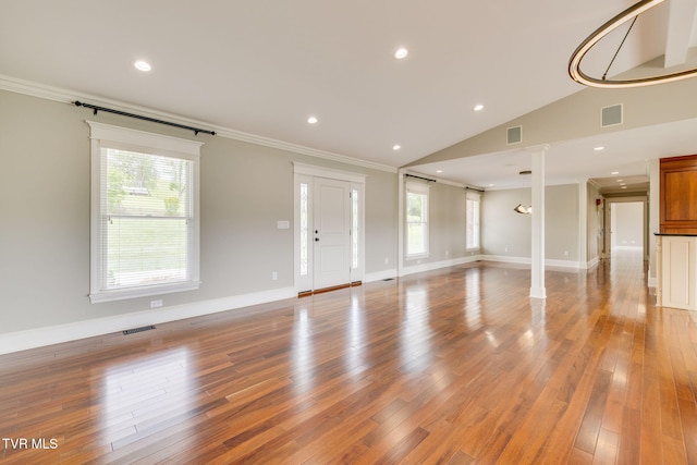 20484 Lake Rd, Abingdon, VA 24211 - unfurnished living room with ornamental molding, plenty of natural light, light wood-type flooring, lofted ceiling, and baseboards