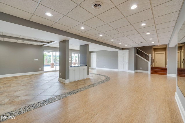 20484 Lake Rd, Abingdon, VA 24211 - unfurnished living room featuring a drop ceiling, baseboards, and recessed lighting