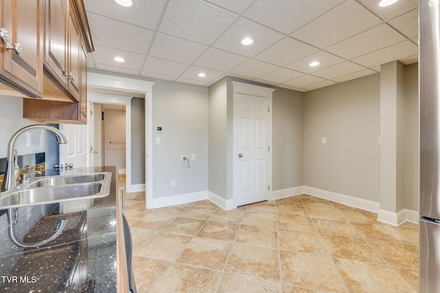 20484 Lake Rd, Abingdon, VA 24211 - kitchen with a sink, brown cabinetry, baseboards, and recessed lighting