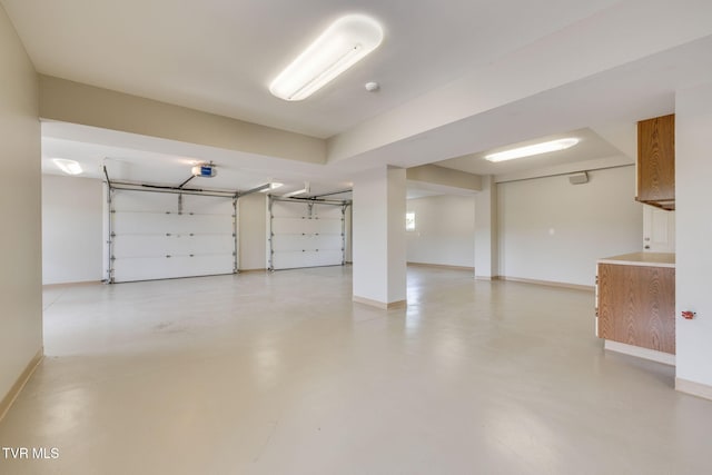 20484 Lake Rd, Abingdon, VA 24211 - garage featuring baseboards and a garage door opener