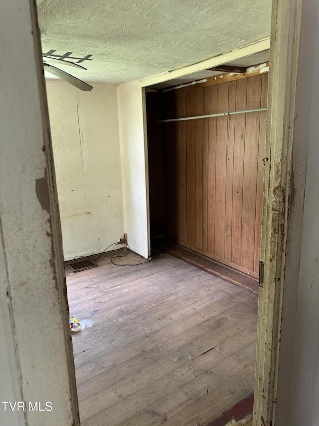 11590 Cedar Rd, Pound, VA 24279 - unfurnished bedroom featuring hardwood / wood-style flooring and a textured ceiling