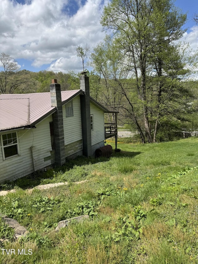 11590 Cedar Rd, Pound, VA 24279 - view of property exterior featuring a chimney and metal roof