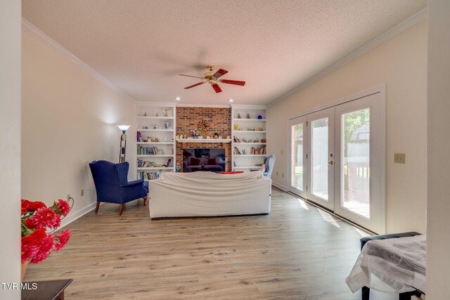 3502 Bondwood Cir, Johnson City, TN 37604 - living area with a textured ceiling, light wood finished floors, a ceiling fan, french doors, and crown molding