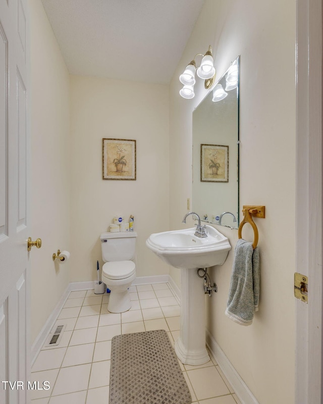 3502 Bondwood Cir, Johnson City, TN 37604 - half bathroom featuring tile patterned flooring, toilet, and baseboards