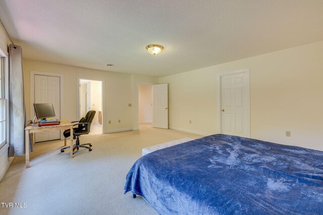 3502 Bondwood Cir, Johnson City, TN 37604 - bedroom with light colored carpet, a desk, a textured ceiling, and baseboards