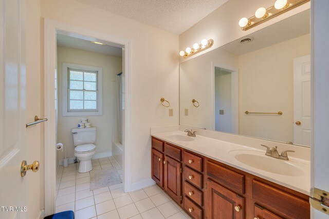 3502 Bondwood Cir, Johnson City, TN 37604 - bathroom with tile patterned flooring, double vanity, toilet, a textured ceiling, and baseboards