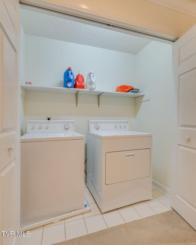 3502 Bondwood Cir, Johnson City, TN 37604 - laundry area featuring washer and clothes dryer and light tile patterned floors