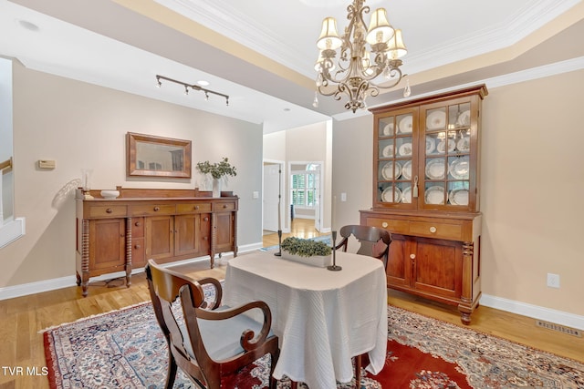 5 Fox Run Ln, Johnson City, TN 37604 - dining area with light wood-style floors, a chandelier, baseboards, and ornamental molding