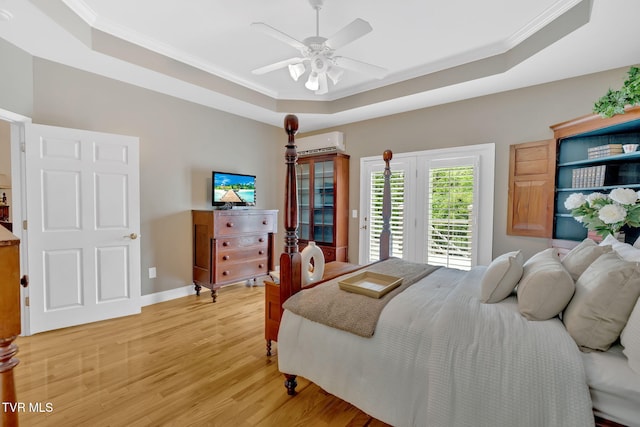 5 Fox Run Ln, Johnson City, TN 37604 - bedroom featuring a tray ceiling, access to outside, light wood-style floors, crown molding, and a wall mounted AC