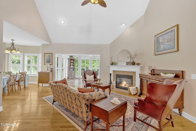 5 Fox Run Ln, Johnson City, TN 37604 - living room with high vaulted ceiling, baseboards, light wood-type flooring, a fireplace, and healthy amount of natural light