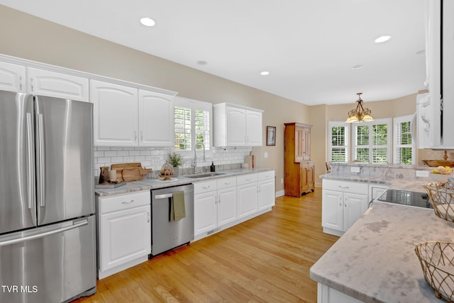 5 Fox Run Ln, Johnson City, TN 37604 - kitchen featuring appliances with stainless steel finishes, a sink, backsplash, white cabinetry, and recessed lighting