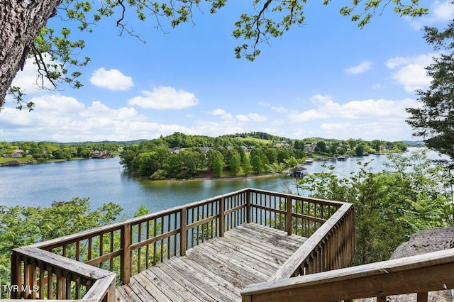 wooden deck featuring a water view