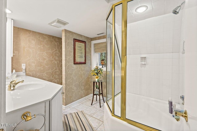 full bath featuring bath / shower combo with glass door, baseboards, wallpapered walls, tile patterned floors, and vanity