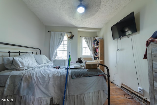 1496 Old State Route 34, Telford, TN 37690 - bedroom with a textured ceiling and wood finished floors