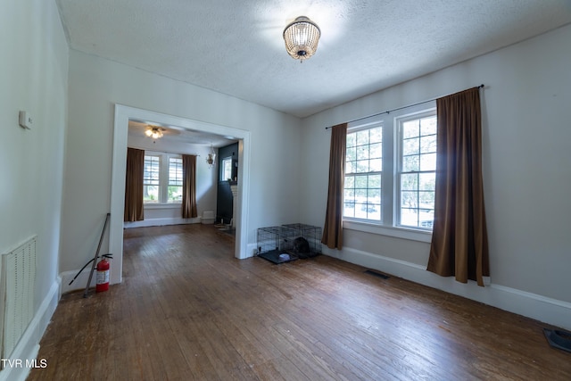 1496 Old State Route 34, Telford, TN 37690 - empty room featuring wood-type flooring, a textured ceiling, and baseboards