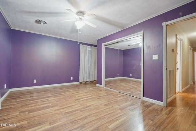 8020 Rock Switch Rd, Wise, VA 24293 - unfurnished bedroom with light wood-type flooring, baseboards, crown molding, a textured ceiling, and a ceiling fan