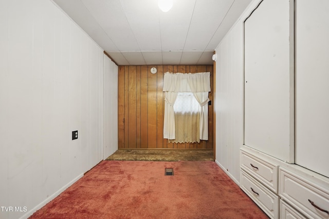 8020 Rock Switch Rd, Wise, VA 24293 - carpeted empty room featuring wooden walls and baseboards