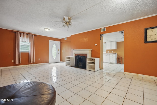 8020 Rock Switch Rd, Wise, VA 24293 - unfurnished living room featuring ceiling fan, a textured ceiling, a brick fireplace, crown molding, and light tile patterned flooring