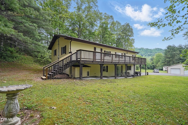 8020 Rock Switch Rd, Wise, VA 24293 - back of property featuring a wooden deck, a yard, stairs, a patio area, and a garage