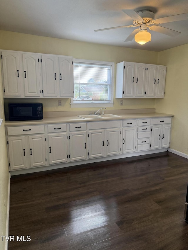 379 SW Oakland St, Abingdon, VA 24210 - kitchen featuring black microwave, a sink, white cabinetry, dark wood-style flooring, and ceiling fan