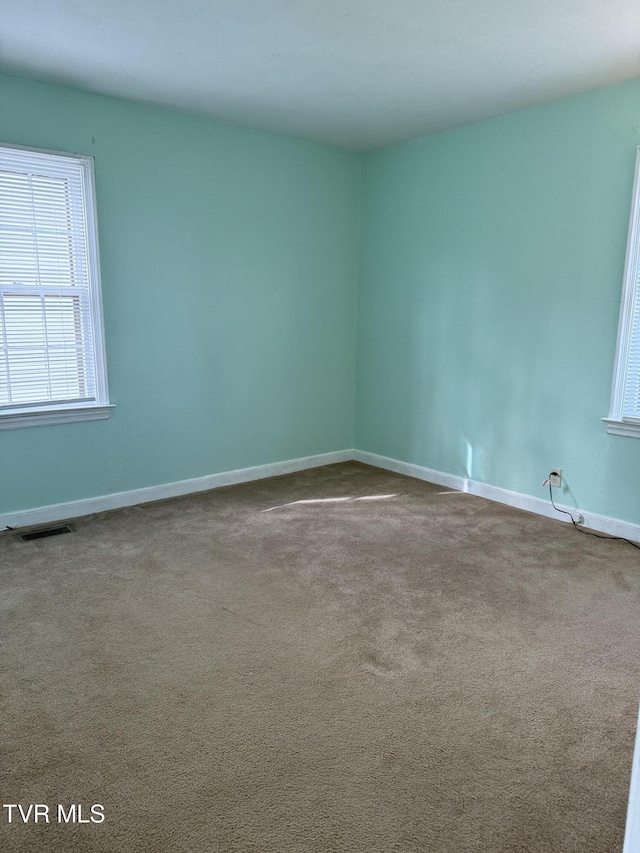 379 SW Oakland St, Abingdon, VA 24210 - spare room with dark carpet and baseboards