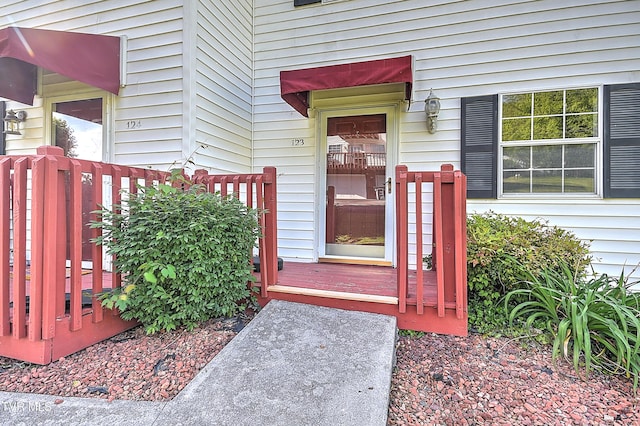property entrance with a deck