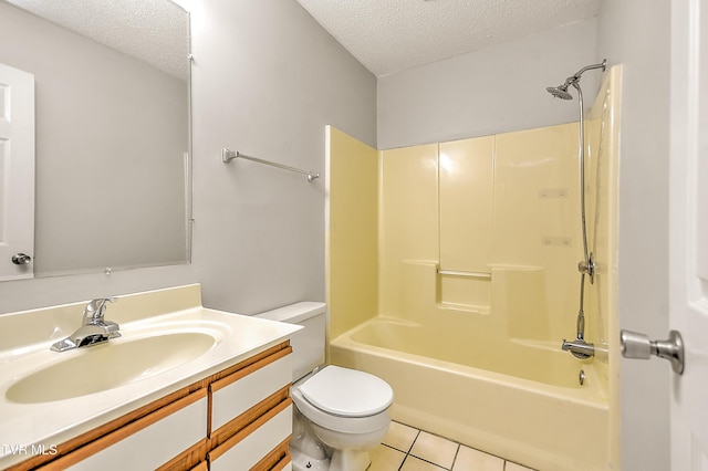 full bath featuring a textured ceiling, toilet, tile patterned floors, vanity, and washtub / shower combination