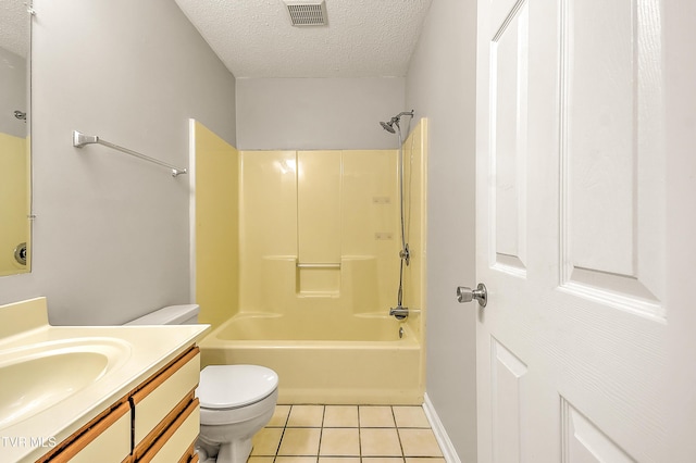 full bath with a textured ceiling, tile patterned floors, toilet, vanity, and washtub / shower combination