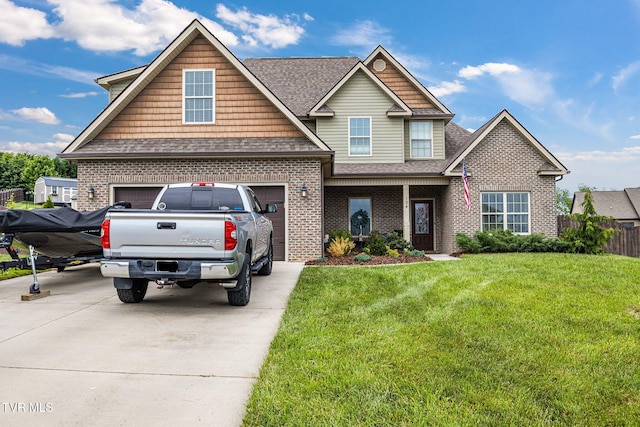 134 Chancery Ct, Piney Flats, TN 37686 - view of front of house with driveway, a shingled roof, brick siding, and a garage