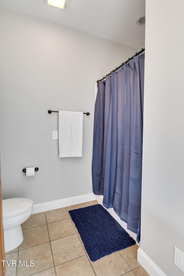 134 Chancery Ct, Piney Flats, TN 37686 - full bathroom with tile patterned flooring, toilet, baseboards, and a shower with shower curtain