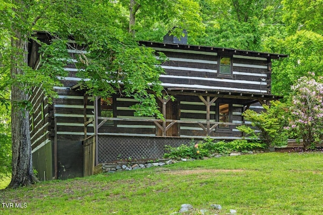 2318 Westwood St, Johnson City, TN 37604 - rear view of house featuring log siding and a yard