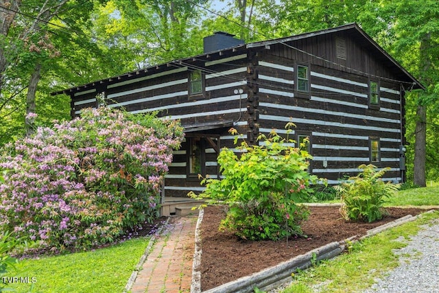 2318 Westwood St, Johnson City, TN 37604 - view of side of home featuring a chimney and log exterior