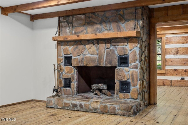 2318 Westwood St, Johnson City, TN 37604 - detailed view of wood finished floors, baseboards, and a fireplace