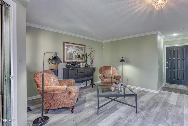 living area with ornamental molding, wood finished floors, baseboards, and recessed lighting