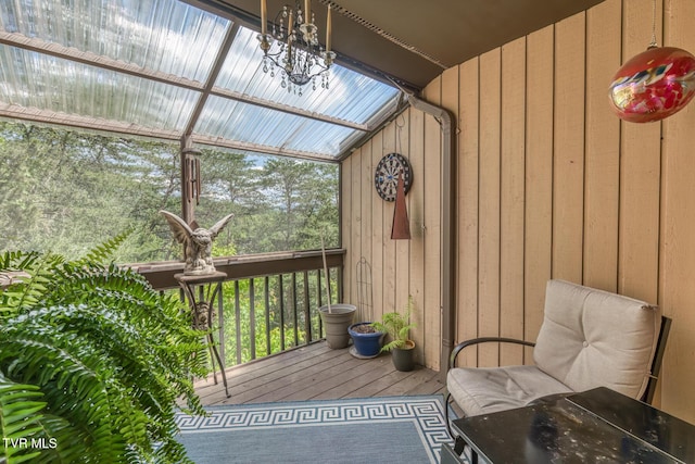 unfurnished sunroom with a chandelier