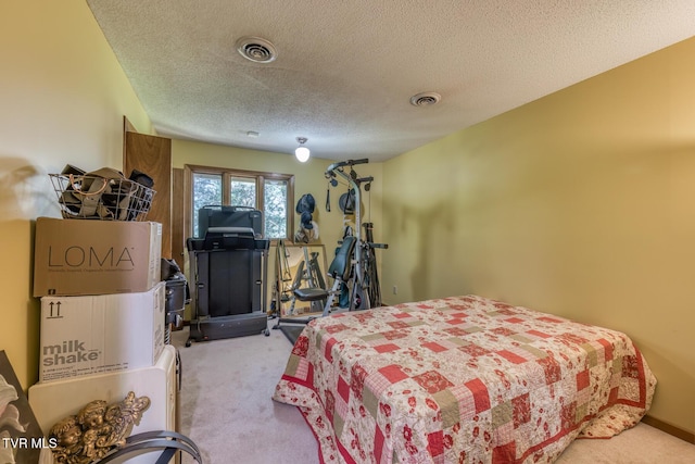 carpeted bedroom featuring a textured ceiling