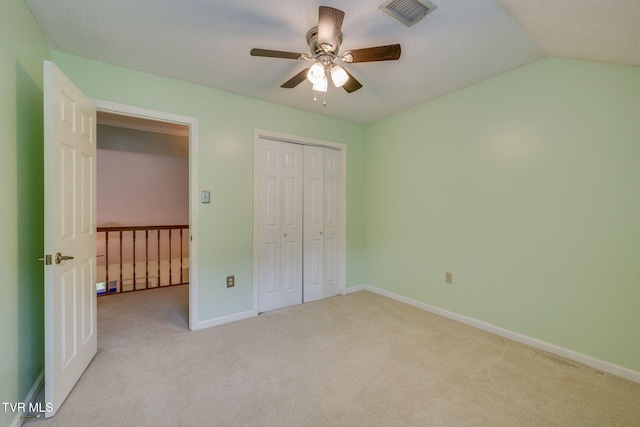 212 Old Castle Rd, Kingsport, TN 37660 - unfurnished bedroom featuring carpet floors, baseboards, a closet, ceiling fan, and vaulted ceiling