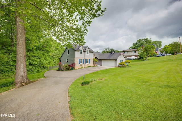 212 Old Castle Rd, Kingsport, TN 37660 - view of front of house featuring asphalt driveway, a front yard, brick siding, and a garage