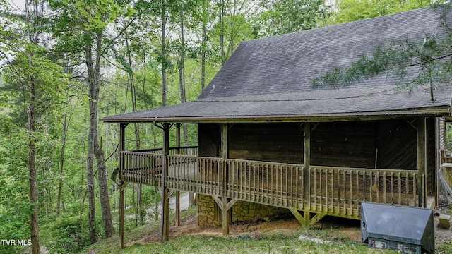 240 Old Railroad Grade Rd, Roan Mountain, TN 37687 - exterior space with roof with shingles, a forest view, and a wooden deck