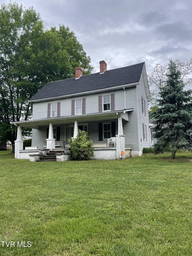 380 Oak Grove Rd, Johnson City, TN 37615 - view of front of home featuring covered porch, a chimney, and a front lawn