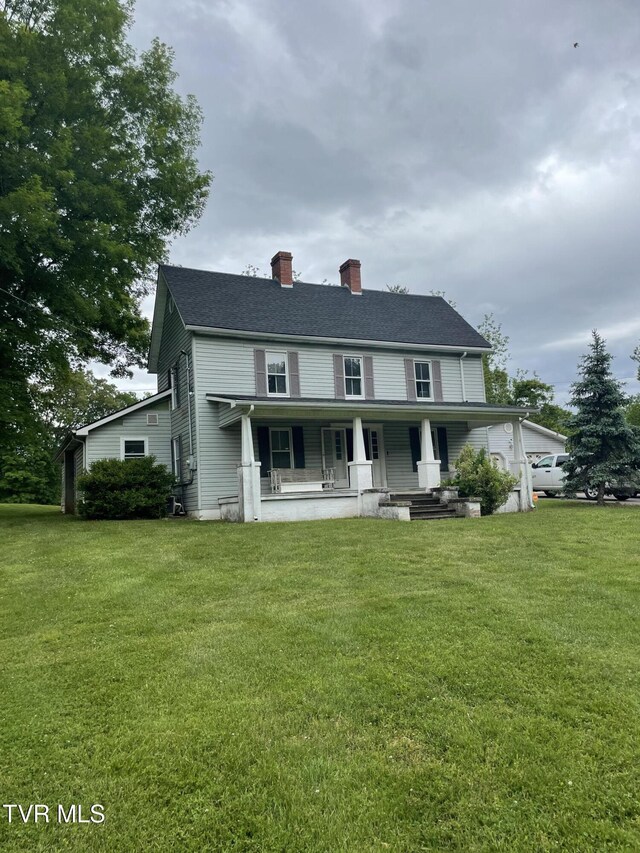 380 Oak Grove Rd, Johnson City, TN 37615 - country-style home featuring a porch, a chimney, and a front yard