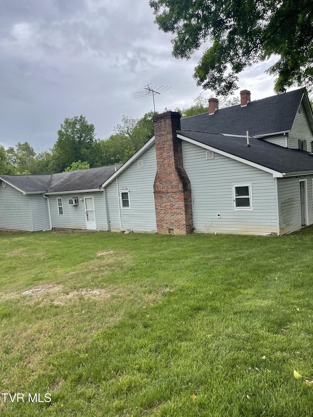 380 Oak Grove Rd, Johnson City, TN 37615 - rear view of house featuring a lawn and a chimney